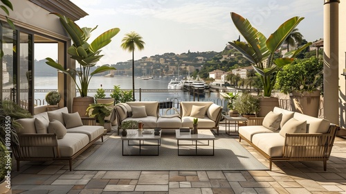 A Mediterranean-style terrace with tiled flooring and plush outdoor sofas, offering views of a bustling harbor. © Eric