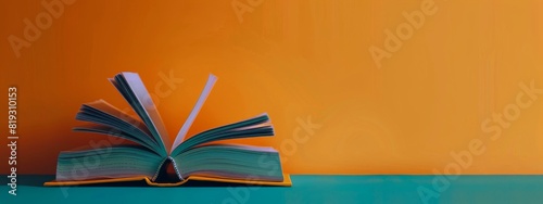 Stack of Books on Orange Background