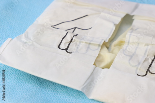 Close up of a sterile glove pack above a sterile surface 