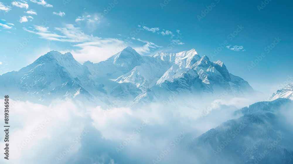snow-capped mountains in the clouds. A breathtaking view of snow-capped mountains partially covered by fluffy clouds, creating a serene and majestic scene..