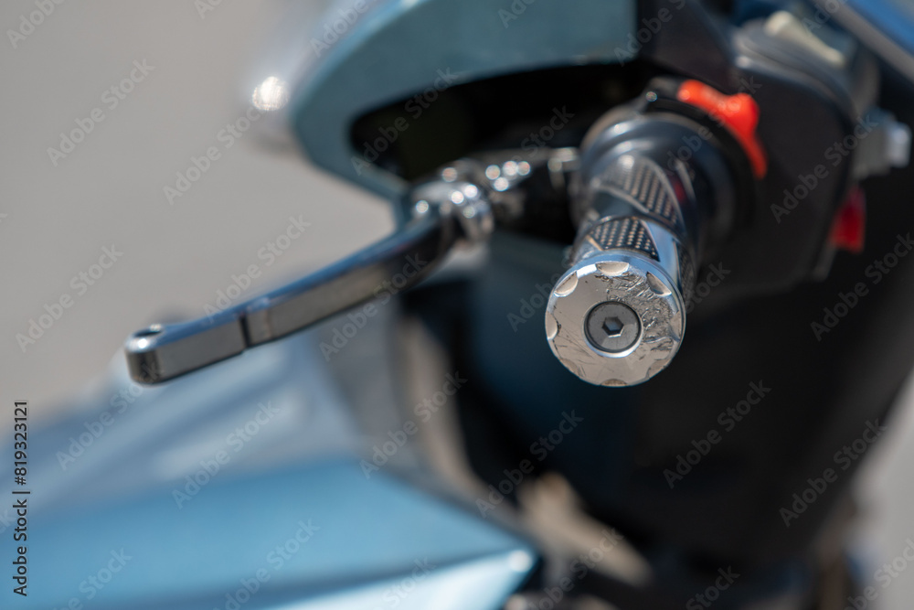 Precision in Focus. A Close-Up of the Left Side Handlebar on a Motorbike. Precision in Focus. A Close-Up of the Left Side Handlebar on a Motorbike.