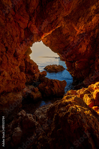 Sunset View Through Coastal Cave