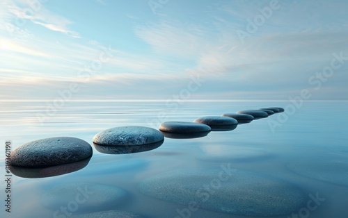 Smooth stones lined up on a serene water surface under a soft blue sky.