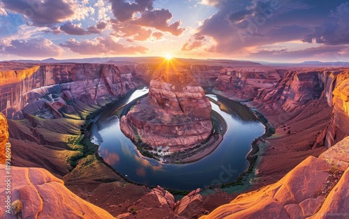 Sunset illuminates a horseshoe-shaped river bend surrounded by rugged cliffs.