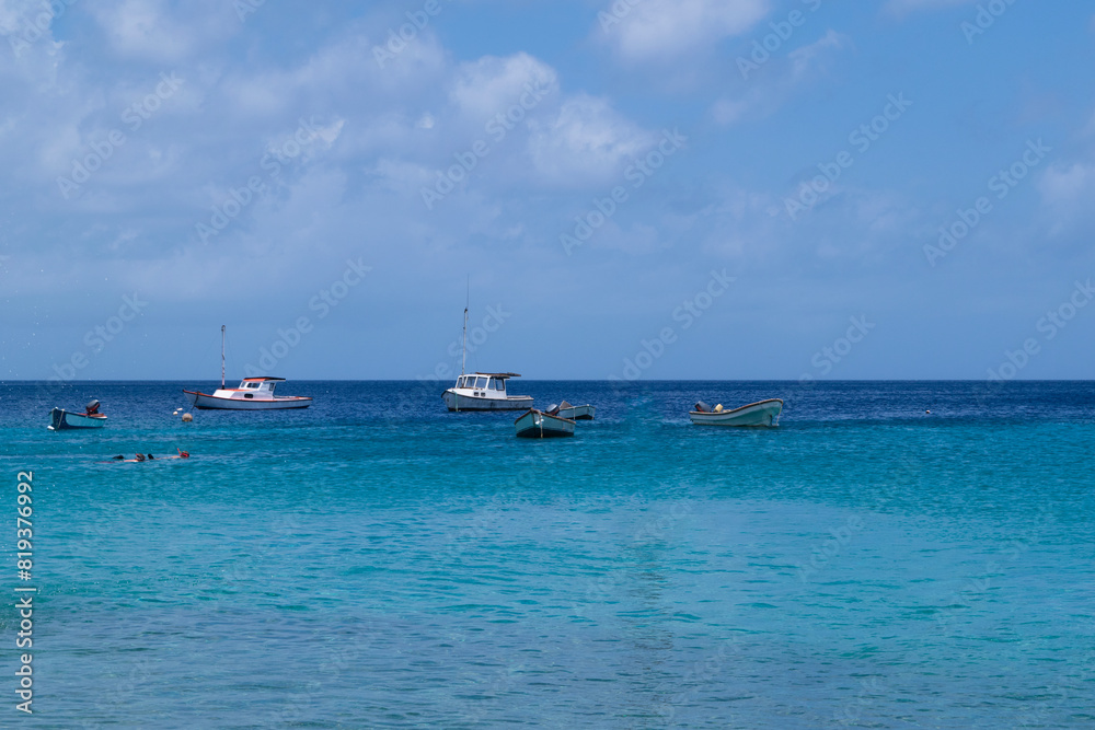 View of boats saliling in the caribbean sea seen from Cas Abao beach, Curacao View of boats saliling in the caribbean sea seen from Cas Abao beach, Curacao
