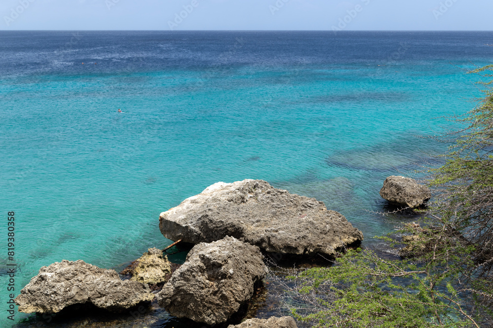 Caribbean Seascape: Dramatic Rocky Coastline Meets Azure Waters Caribbean Seascape: Dramatic Rocky Coastline Meets Azure Waters