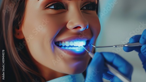 Young woman whiten teeth at the dentist. Close up view