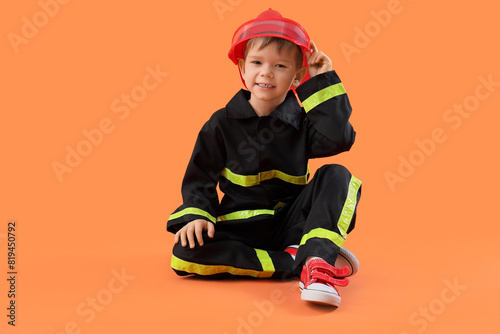 Cute little firefighter sit...