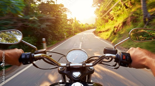 Motorcycle riding on a scenic road at sunrise, showcasing freedom, adventure, and the beauty of nature. © stockpro