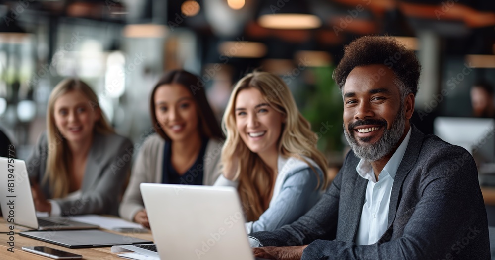 A diverse group of coworkers collaborating in a modern office setting, multicultural business people A diverse group of coworkers collaborating in a modern office setting, multicultural business people