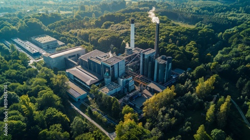 A state-of-the-art power plant nestled among trees, showcasing a commitment to green industry and eco power. This sustainable energy model aims for environmental friendliness and  photo
