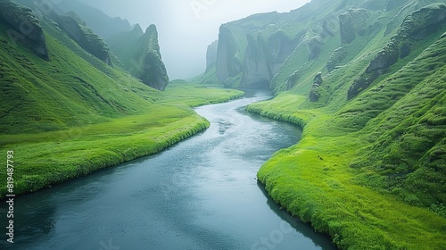 A river flowing through a lush green valley, representing the life-giving force of nature and the importance of preserving waterways..stock image photo