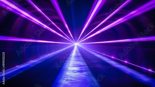 Blue and violet laser beams illuminate the black background, forming a striking and vivid light display. The beams' brilliance and the stark contrast with the dark backdrop create a captivating