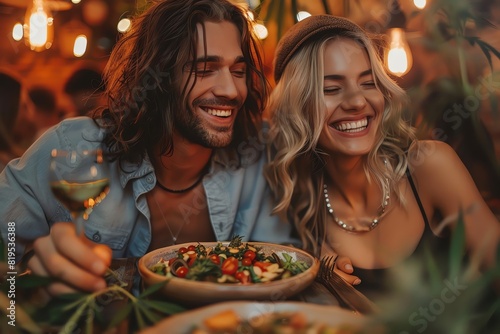 Couple enjoying a romantic dinner with wine and salad under warm