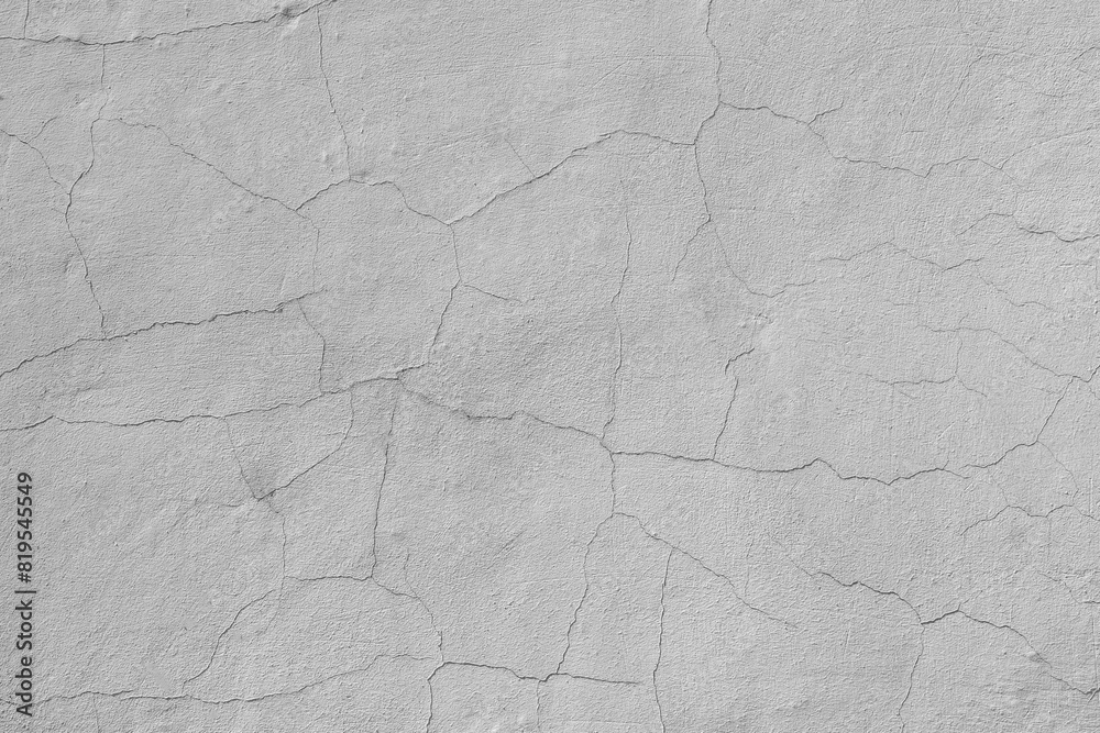 Cracks on the white plaster wall. Abstract design background. Cracks on the white plaster wall. Abstract design background.
