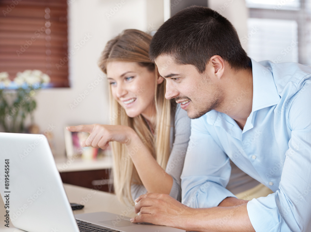 Couple, home and computer for reading news, planning and online shopping in kitchen with choice. Woman and man on laptop with e commerce software or website for information, registration and sign up Couple, home and computer for reading news, planning and online shopping in kitchen with choice. Woman and man on laptop with e commerce software or website for information, registration and sign up
