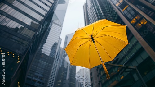 Solitary Umbrella Against Towering City Skyline Symbolizes Resilience in the Business Landscape © pkproject