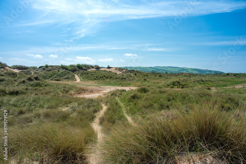 Sand dunes and beach at Talacre a popular tourist destination in North Wales on a bright sunny summer day.