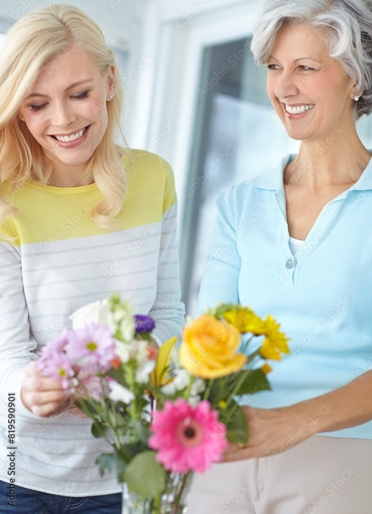 Smile, parent and happy woman with flowers in home together with love, pride or wellness for gardening. Mothers day, senior or daughter bonding in family house with mom, plants or gift present in USA