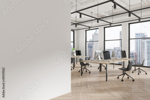 Office coworking interior with desks and pc monitors, window. Mock up wall © ImageFlow