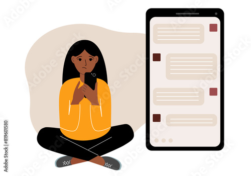 A woman sits and holds a phone. The correspondence is visible on the screen. Concept of chat, sms, service, technical support.