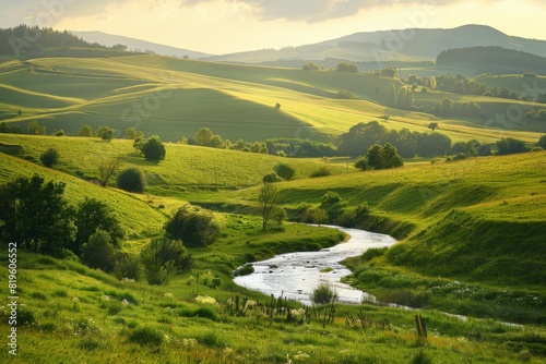 Rolling Green Hills with Stream at Sunset