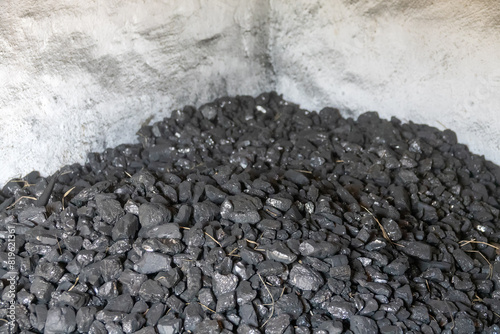 Canvas Print Coal is dumped in a coal warehouse