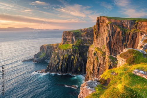 Ocean Cliffs. Scenic View of Rugged Cliffs Above Ocean at Sunset, Neist Point, Isle of Skye photo
