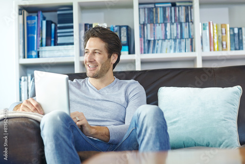 Man, thinking and happy on sofa with tablet for social media memory, online gaming and morning news in lounge of home. Person, smile or digital tech for reading ebook, web search or browsing on couch