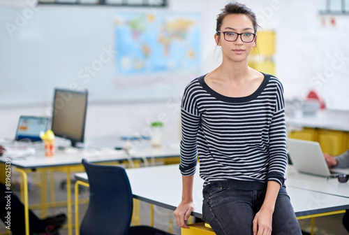 Writer, work and portrait of woman in office for creative career, confidence and pride in job. Journalist, editor and female person by desk for publishing, company and agency in San Fransisco photo