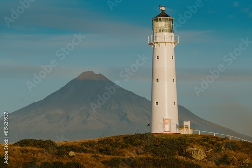Cape Egmont lighthouse, farm;and and Mt Taranaki, Taranaki, New Zealand.
