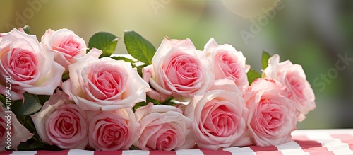 Romantic concept with pink and white striped roses set against a blurred background invoking a sense of aromatherapy ideal for a copy space image