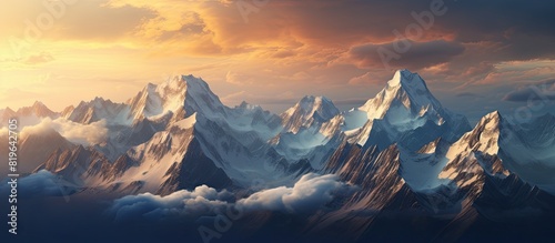 A captivating mountain range at sunset with snow capped peaks shining in golden light against a dramatic sky ideal for nature themed copy space images photo