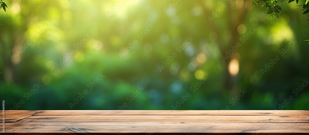 Blurred green background with a wooden table top for copy space image
