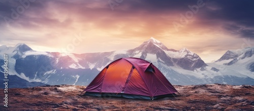 Beautiful mountain backdrop behind a tent with a copy space image included