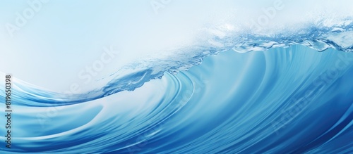 Background photography of an abstract blue water wave with a pure natural swirl pattern texture providing a captivating copy space image