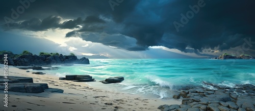 A serene beach with turquoise lagoons a rugged rocky shore and a dramatic storm approaching in the distance providing a perfect copy space image