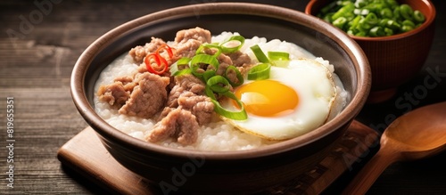 rice porridge with pork and egg with ingredient. Copy space image. Place for adding text and design
