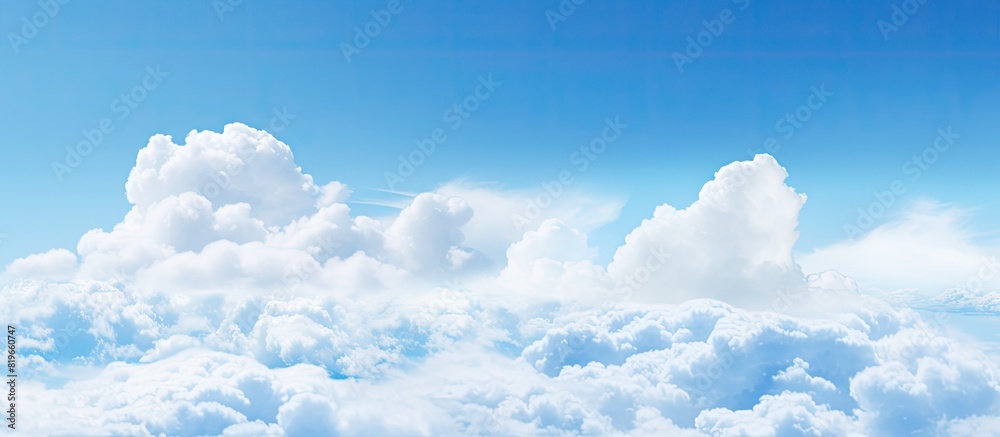 White cloud floating in the vast expanse of the clear blue sky creating a serene and peaceful atmosphere in the scene with copy space image White cloud floating in the vast expanse of the clear blue sky creating a serene and peaceful atmosphere in the scene with copy space image