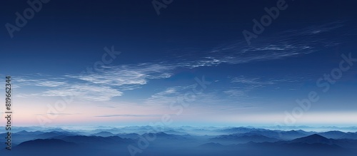 At night a thin layer of clouds covers the blue sky with a slight hint of sunlight remaining creating a tranquil atmosphere in the twilight. Copy space image. Place for adding text and design © Ilgun