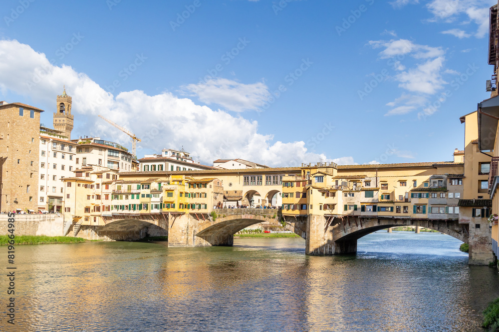Florence, Italy - April 10, 2024: View of the Vecchio Bridge in Florence with tourists crowding its surroundings in Florence, Italy Florence, Italy - April 10, 2024: View of the Vecchio Bridge in Florence with tourists crowding its surroundings in Florence, Italy