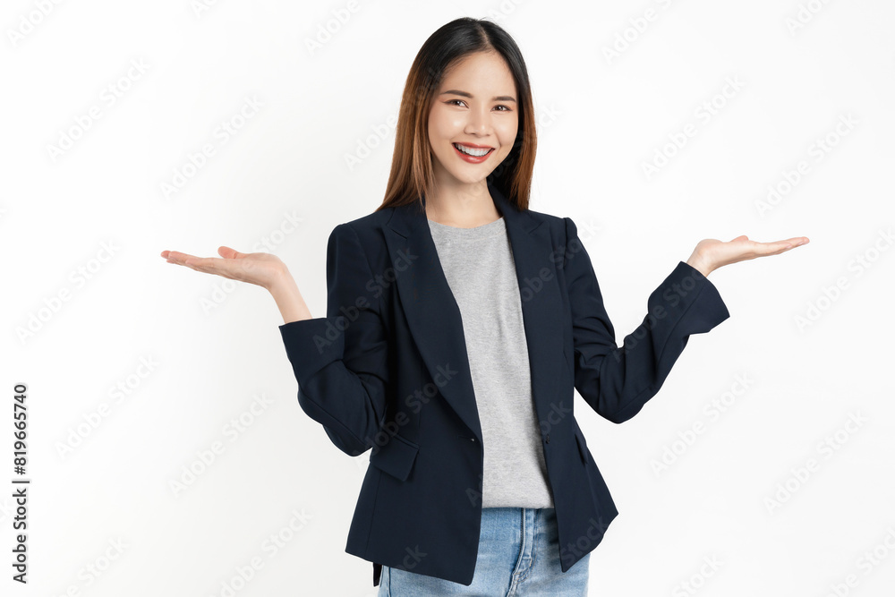 Young beautiful Asian businesswoman standing with open palms to the side isolated on white background. Young beautiful Asian businesswoman standing with open palms to the side isolated on white background.