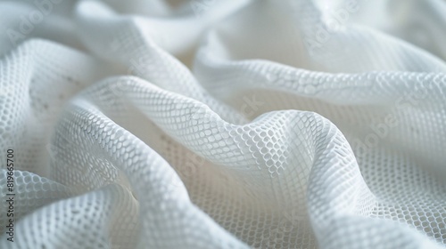 Detailed close-up of breathable white jersey fabric for sportswear