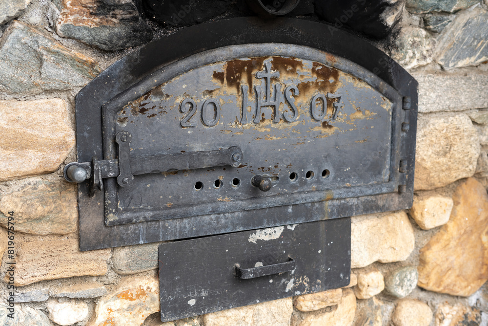 Iron baking oven for bread and pizza with inscription