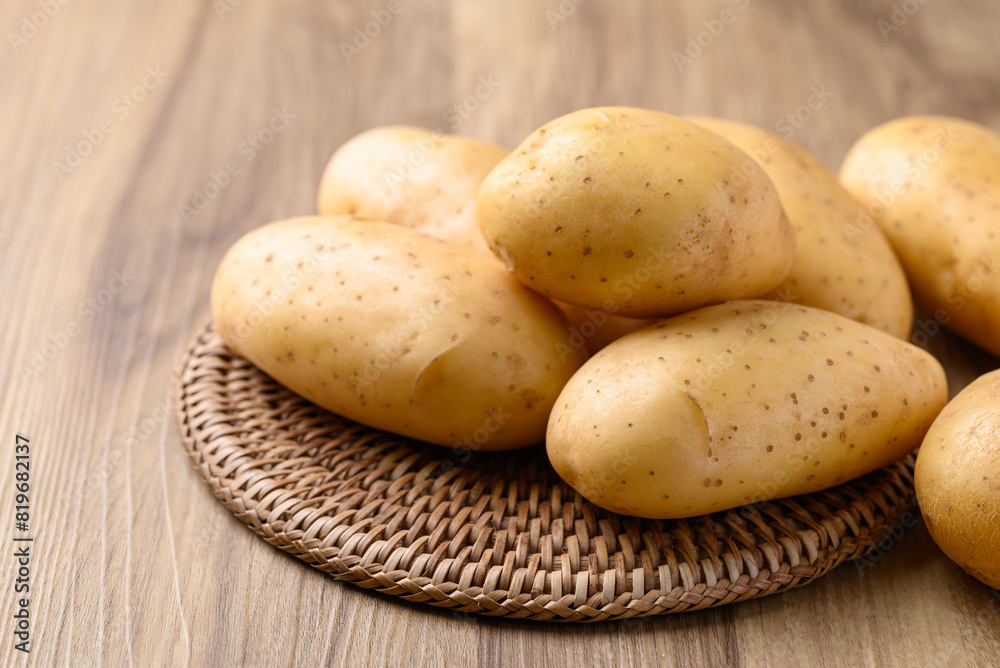 Raw potatoes on wooden background, Food ingredient Raw potatoes on wooden background, Food ingredient