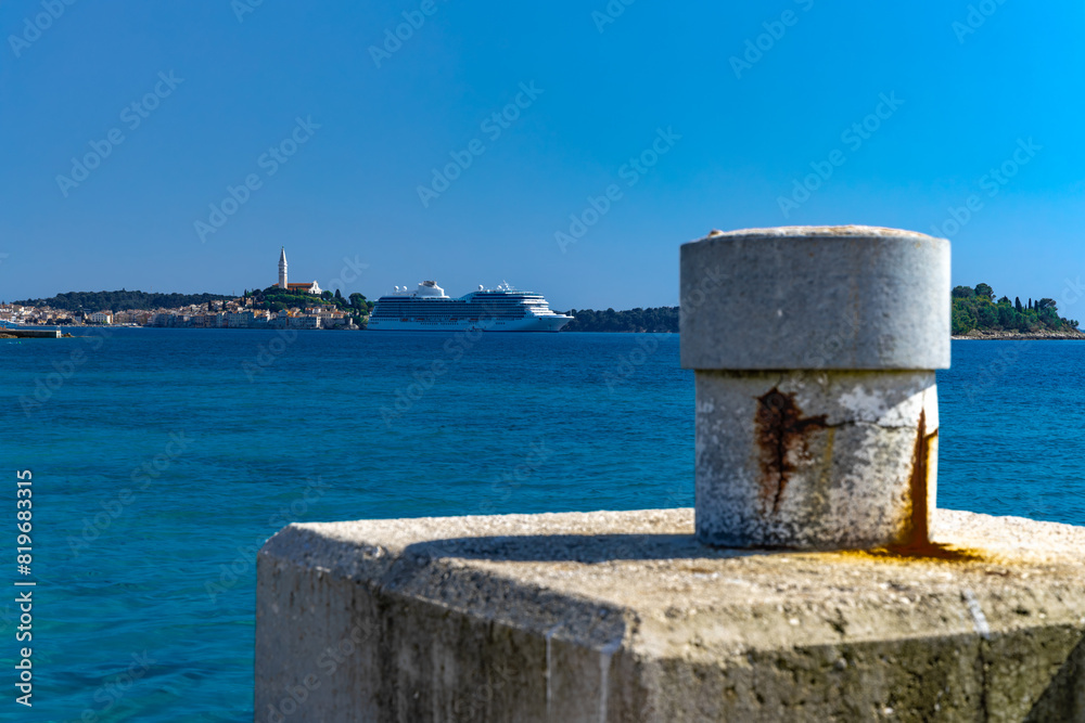 A huge tourist ship enters the port of Rovinj, sailing on the Adriatic Sea on a cruiser