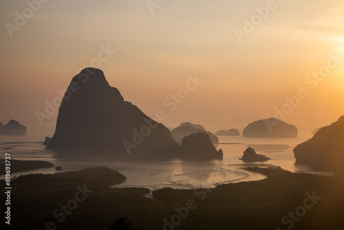 Beautiful and colorful sunrise over the sea. Large rocks in the sea. Dawn in Thailand. Colorful sky in the morning.