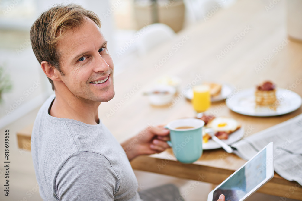 Man, tablet and breakfast with smile in portrait for current events or information at dining table. House, food and weekend with meal for nutrition with entertainment or relaxing at home in Sweden. Man, tablet and breakfast with smile in portrait for current events or information at dining table. House, food and weekend with meal for nutrition with entertainment or relaxing at home in Sweden.