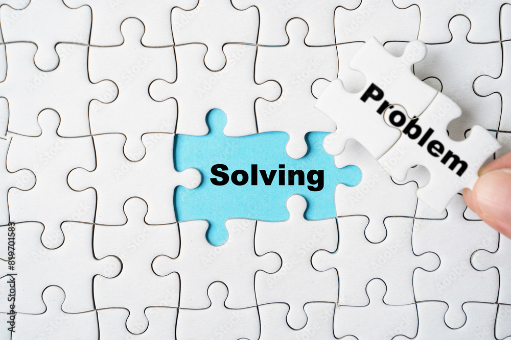Hand holding problem wording on jigsaw and assemble to solving wording for creative thinking idea solution concept. Hand holding problem wording on jigsaw and assemble to solving wording for creative thinking idea solution concept.