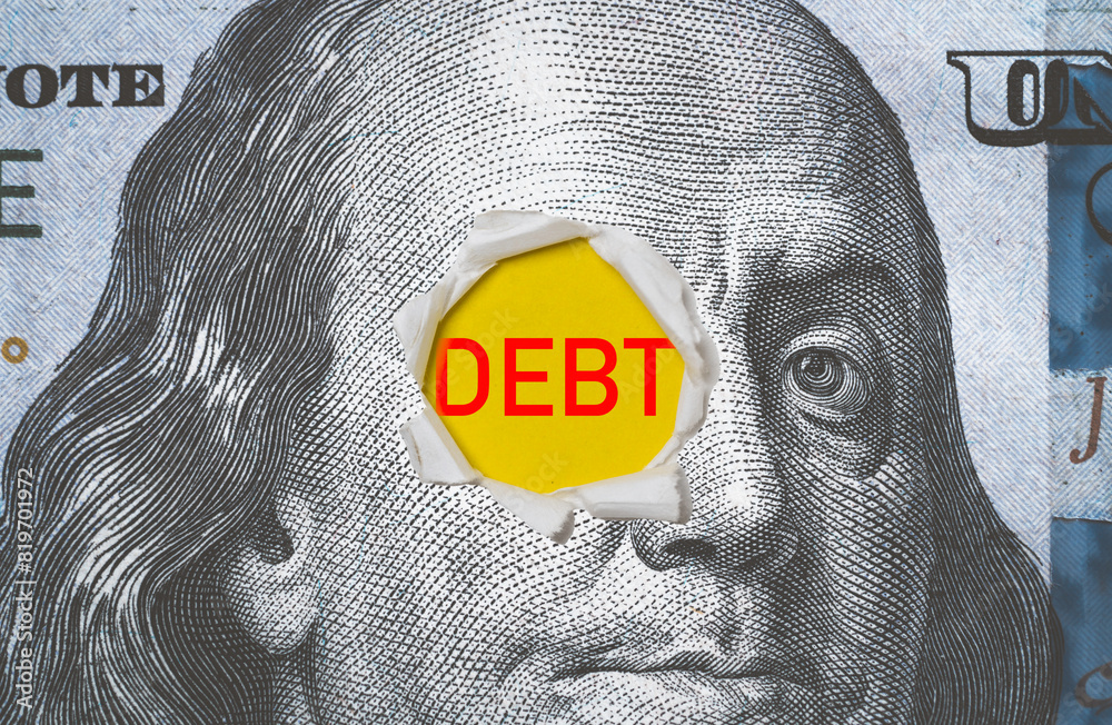 Φωτογραφία Benjamin Franklin face on USD dollar banknote with punching and debt wording for United States of America have high government debt from economic concept